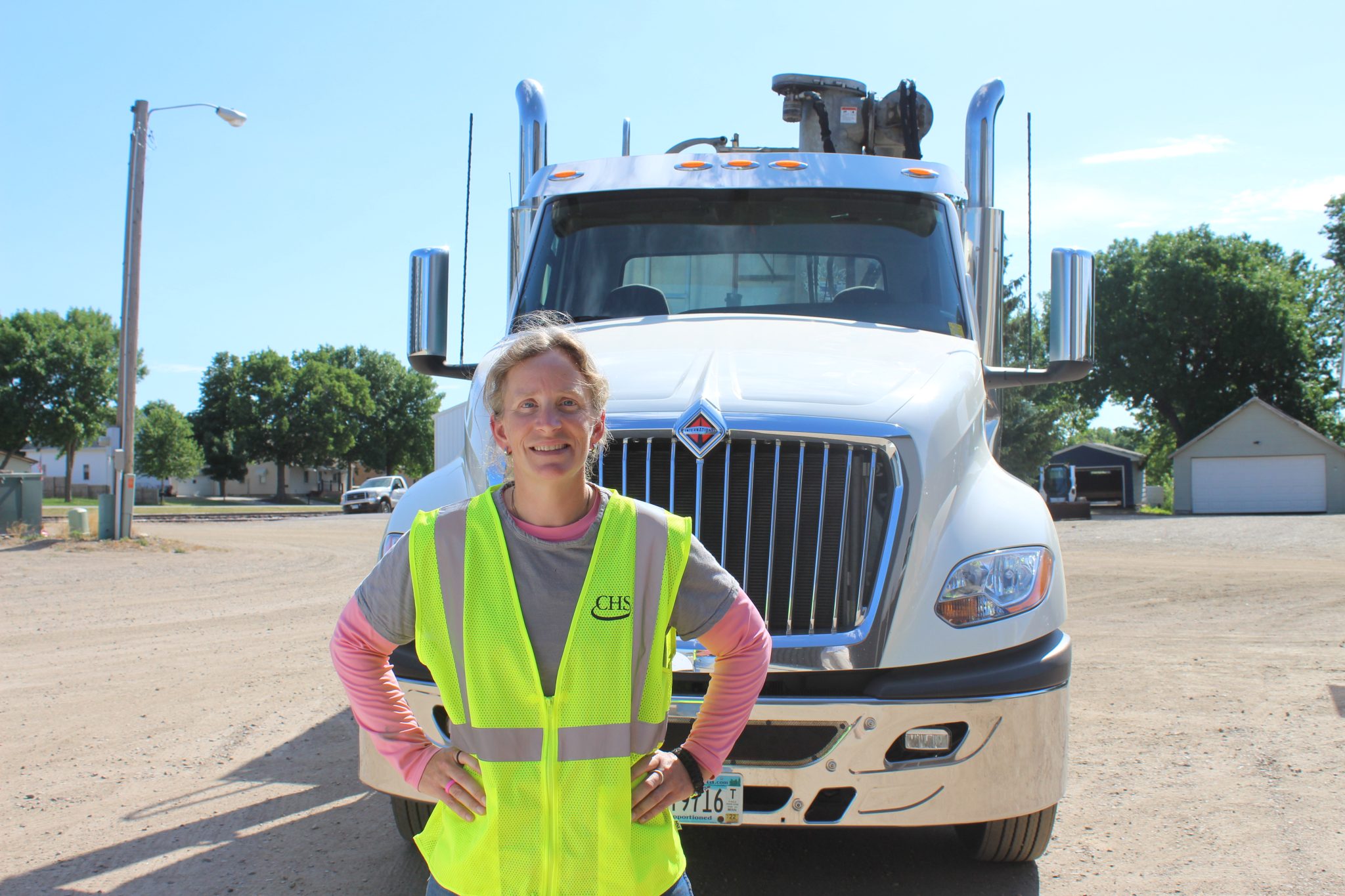 woman standing in front of semi
