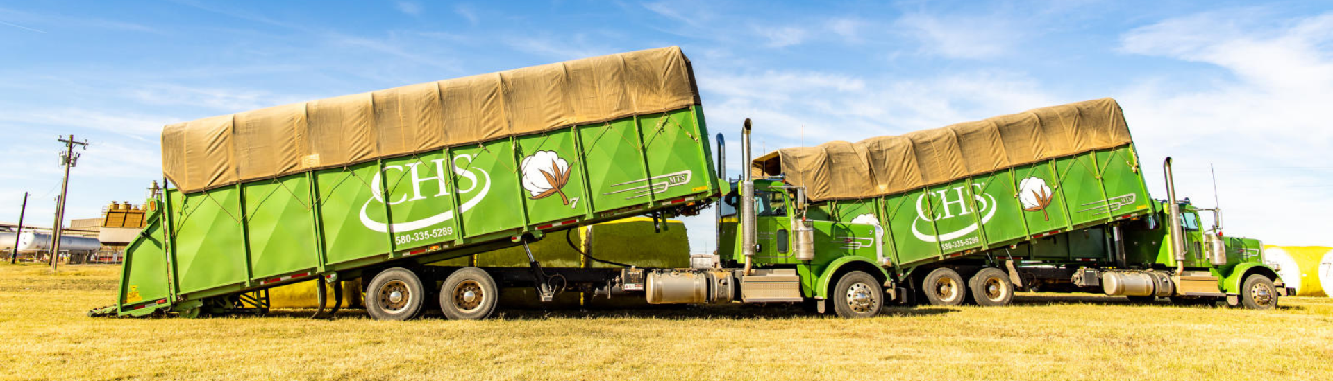 CHS trucks unloading cotton
